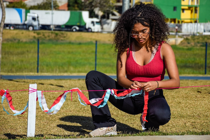 a woman sitting on a rope